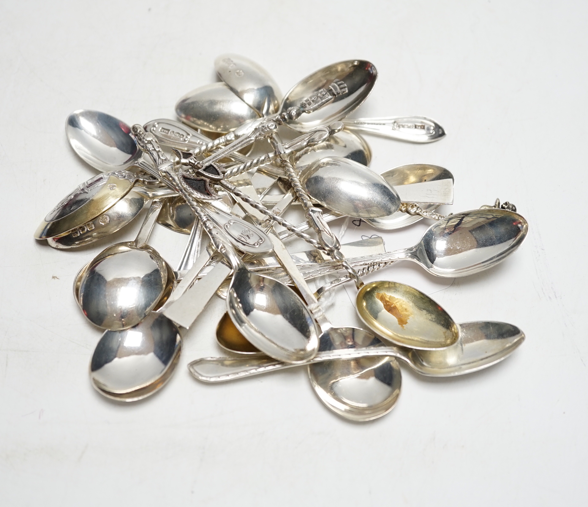 Sundry silver cutlery:- Two sets of six coffee spoons, a ‘’coronation’’ spoon, three souvenir spoons and a set of four apostle spoons.